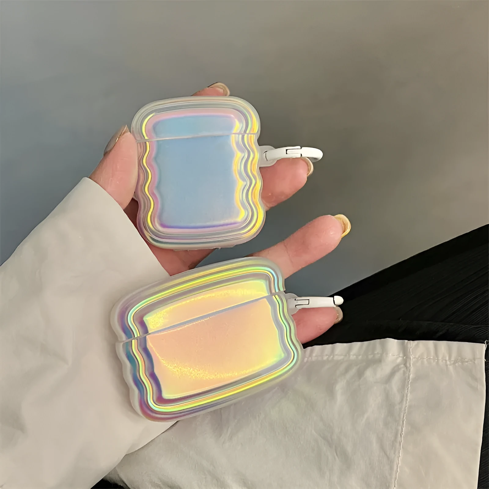 Silicone case for AirPods with a colour-changing magic laser ring on a white background.