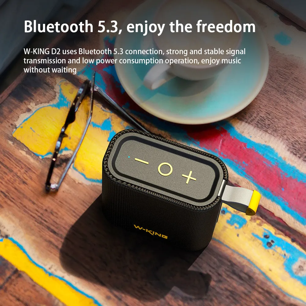 Black portable Bluetooth speaker with compact waterproof design, shown front view