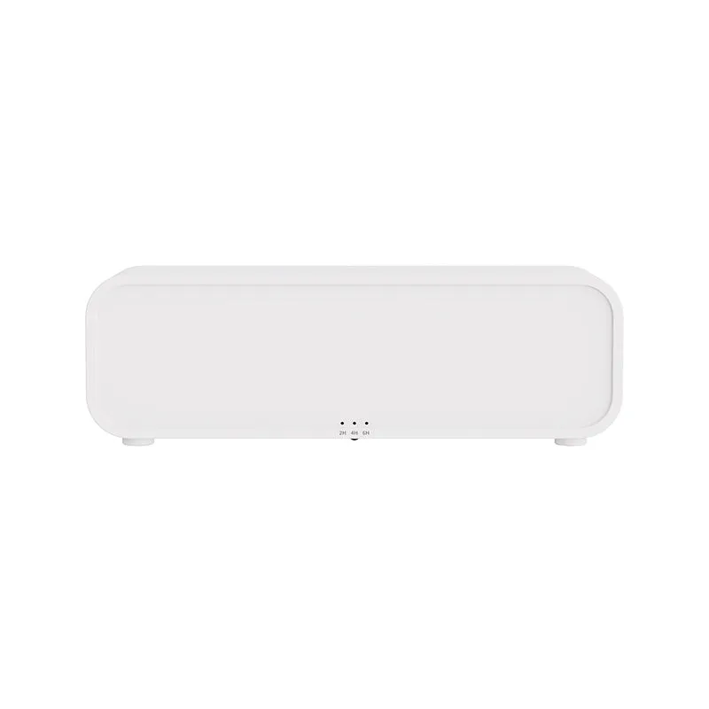 Black and white aromatherapy diffuser with flame LED effect and remote control on wooden surface