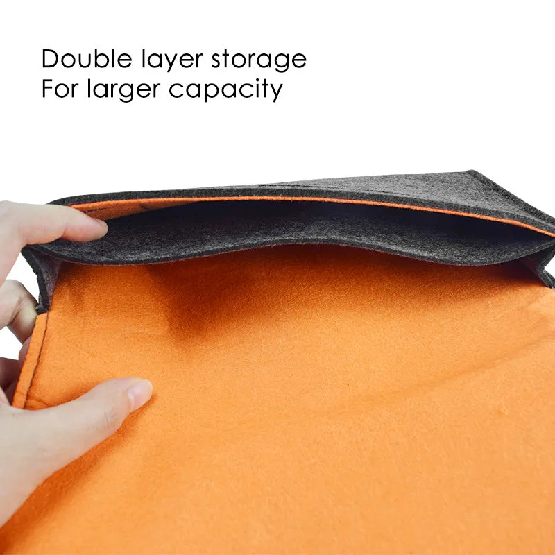 Black felt pouch for Nintendo Switch open to show console compartment and 5 game card slots.