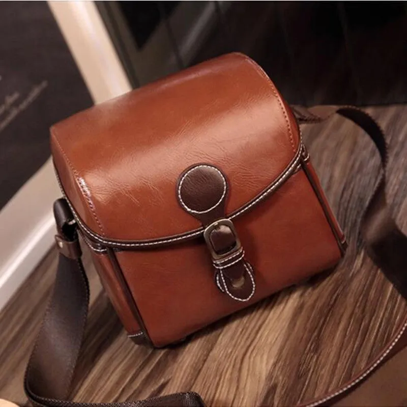 Fashion single shoulder SLR camera liner bag in PU leather, small size, dark coffee colour, for home storage.