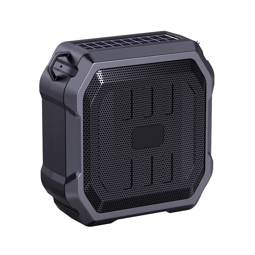 Portable solar camping lantern speaker with Bluetooth, LED light, USB rechargeable, black colour, on outdoor lawn