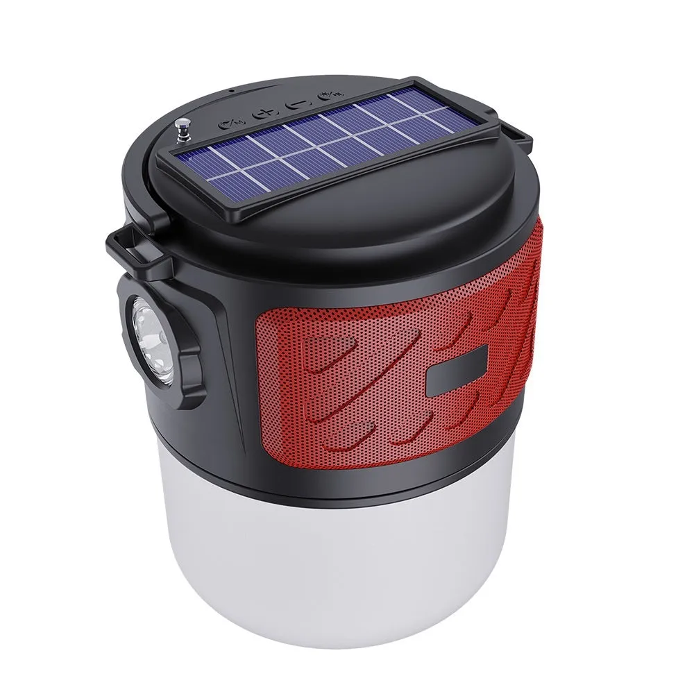 Portable solar camping lantern speaker with Bluetooth, LED light, USB rechargeable, black colour, on outdoor lawn
