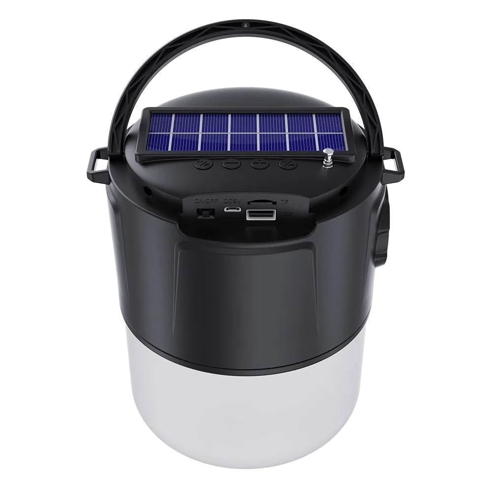 Portable solar camping lantern speaker with Bluetooth, LED light, USB rechargeable, black colour, on outdoor lawn