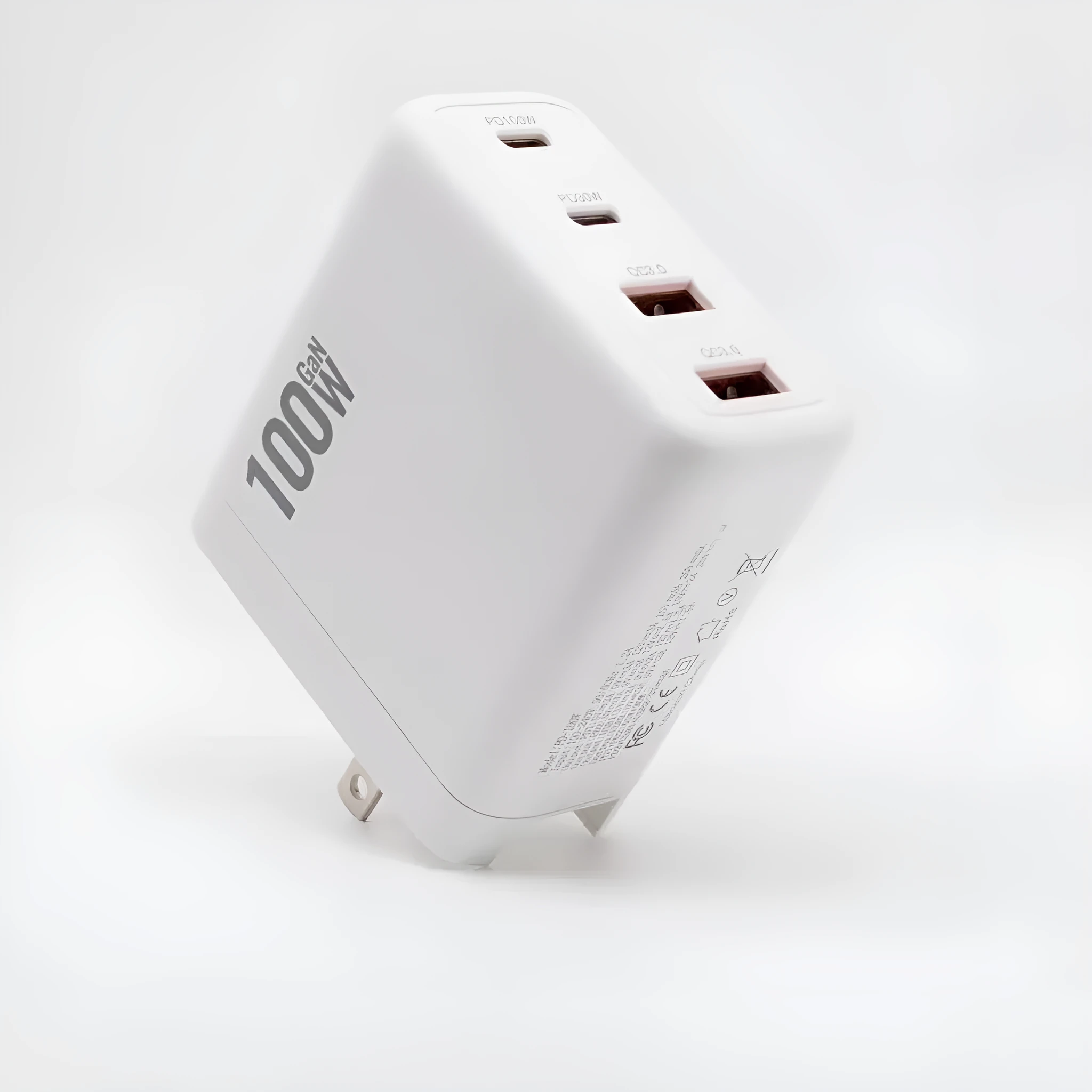 White gallium nitride fast charger 100W with Type-C and USB ports, compact size, interchangeable plugs