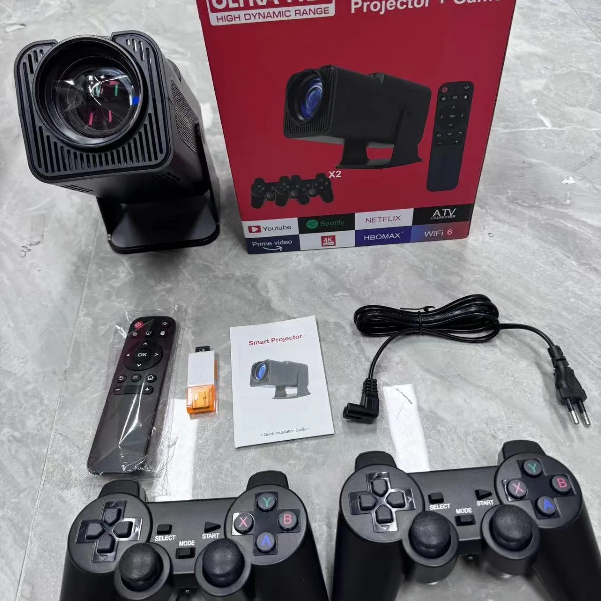 A wireless home gaming projector with a carry handle, showing a 720p HD display on a wall.