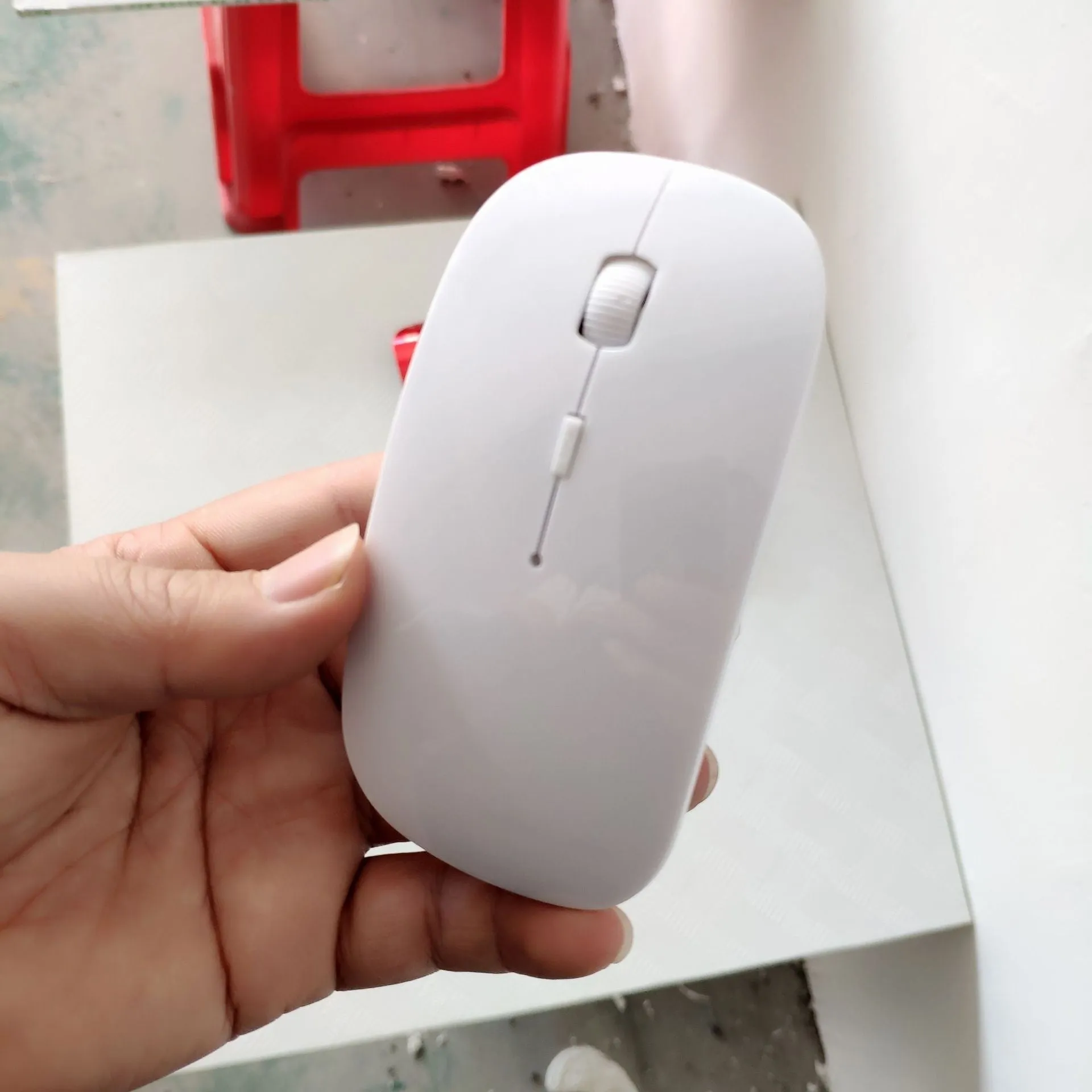 Bluetooth dual-mode wireless mouse with USB receiver and charging cable in grey finish
