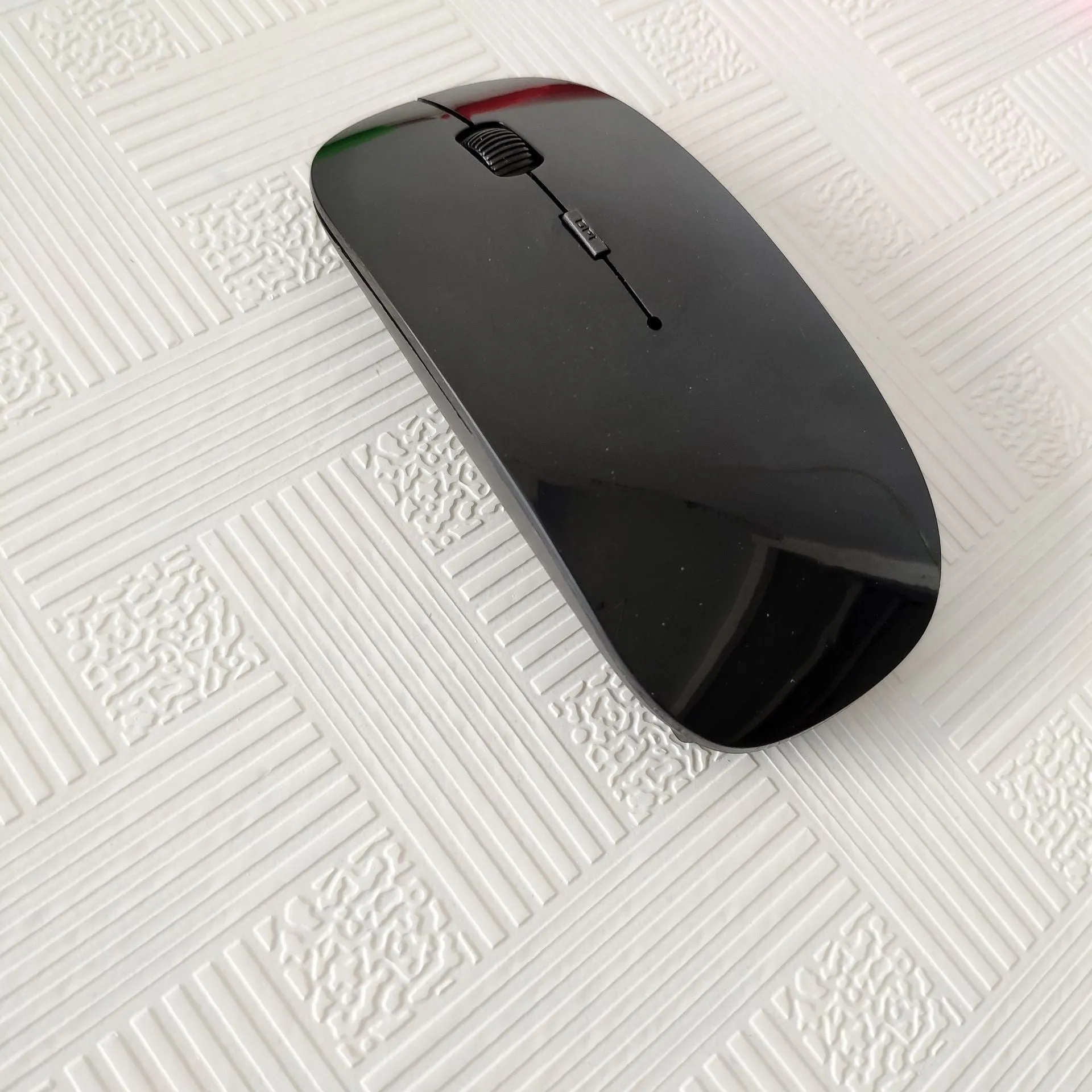 Bluetooth dual-mode wireless mouse with USB receiver and charging cable in grey finish