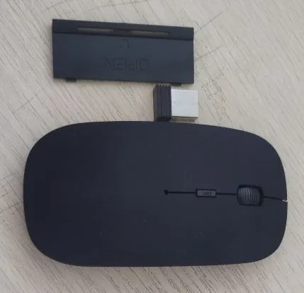 Bluetooth dual-mode wireless mouse with USB receiver and charging cable in grey finish