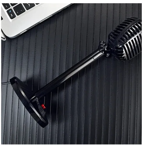 Black USB computer microphone with adjustable neck stand on desktop