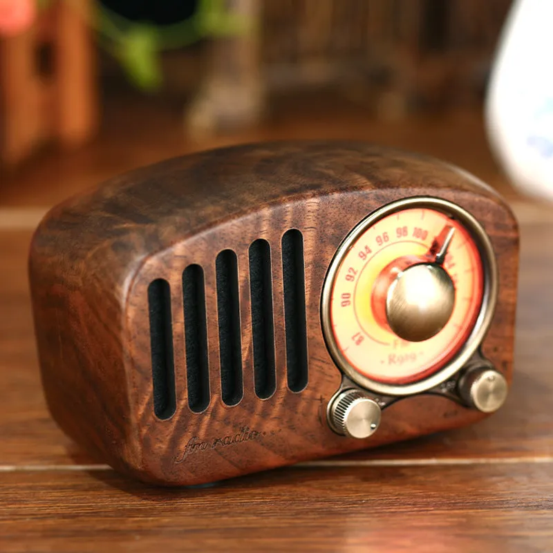 Retro wooden wireless mini speaker in cherry wood finish showing compact dimensions
