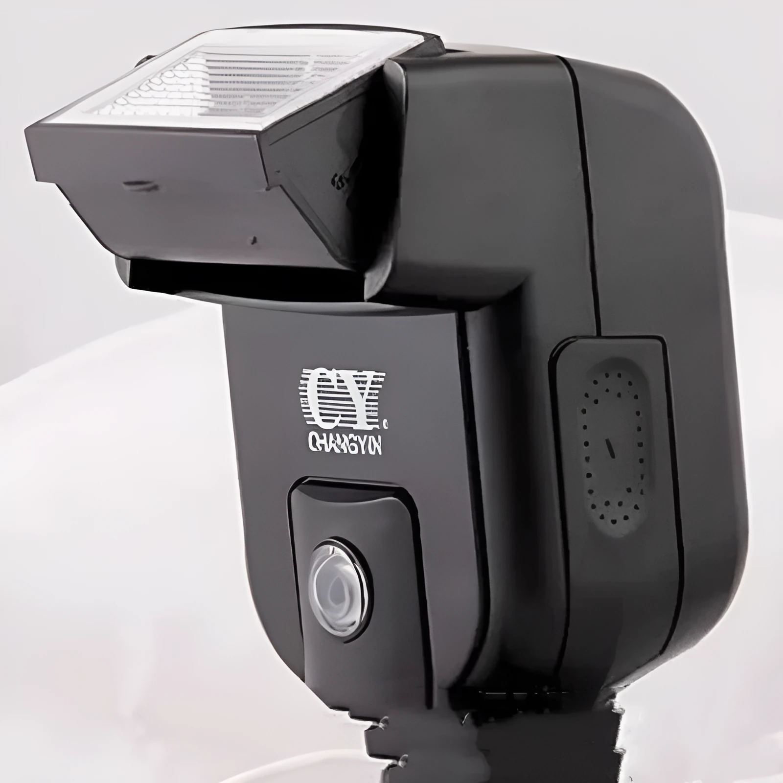 Compact silver SLR camera flash with tilted head mounted on a camera hot shoe