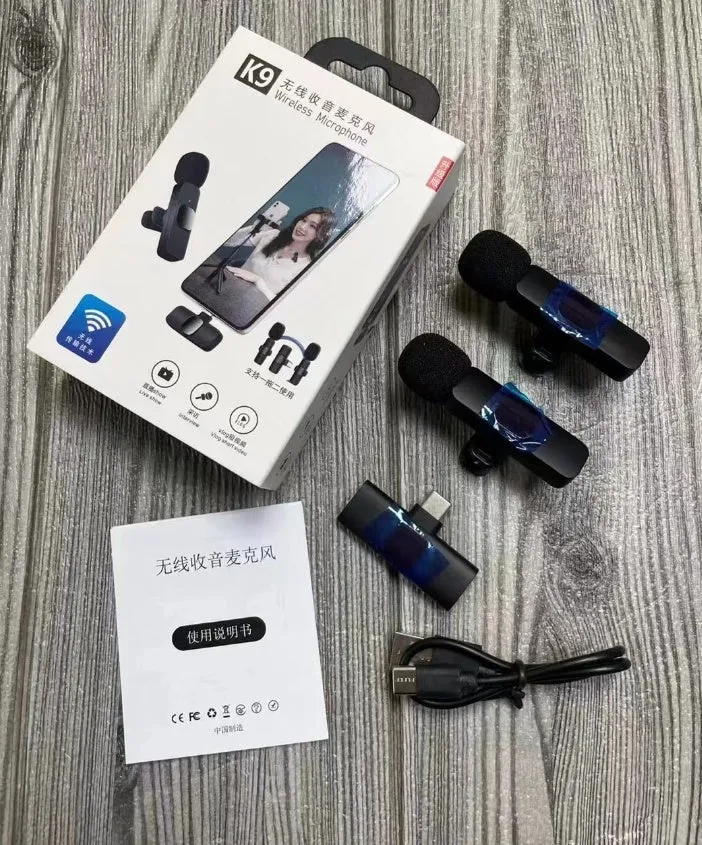 A wireless lavalier clip-on microphone attached to a shirt collar for hands-free video recording.