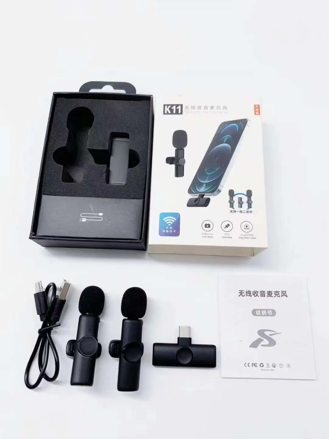 A wireless lavalier clip-on microphone attached to a shirt collar for hands-free video recording.