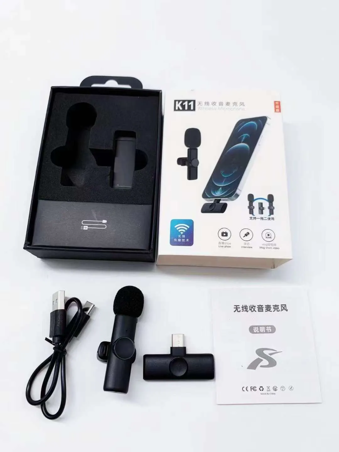 A wireless lavalier clip-on microphone attached to a shirt collar for hands-free video recording.