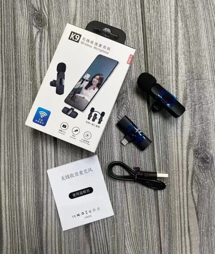 A wireless lavalier clip-on microphone attached to a shirt collar for hands-free video recording.