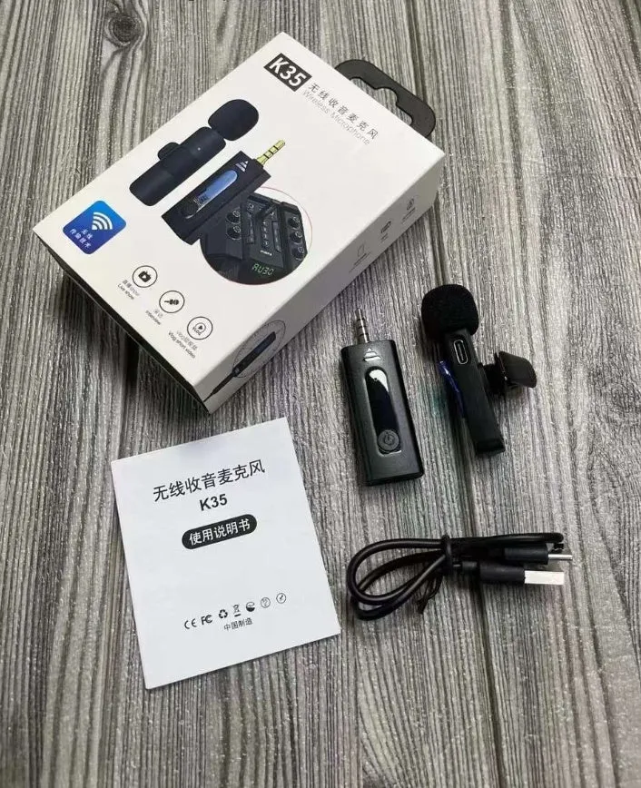 A wireless lavalier clip-on microphone attached to a shirt collar for hands-free video recording.