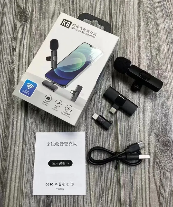 A wireless lavalier clip-on microphone attached to a shirt collar for hands-free video recording.