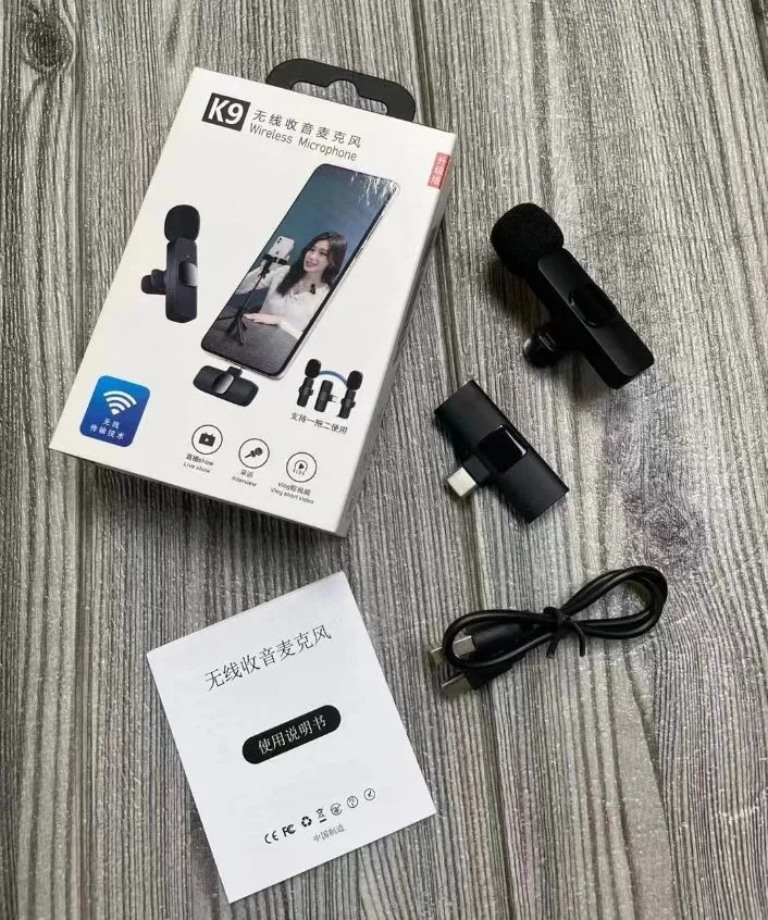 A wireless lavalier clip-on microphone attached to a shirt collar for hands-free video recording.
