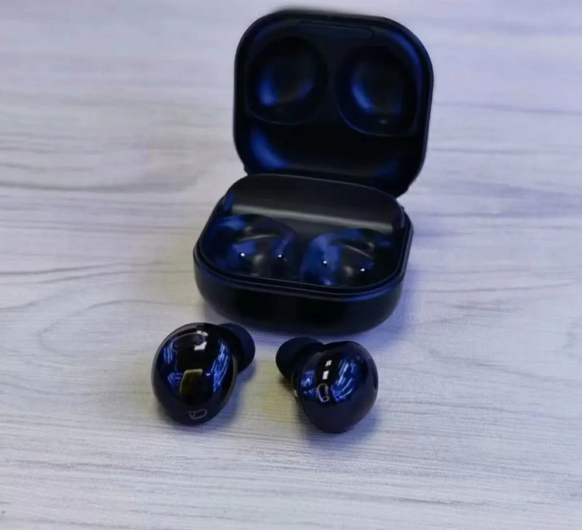 R190 TWS 5.0 binaural Bluetooth headset in black with earplug design and charging cable