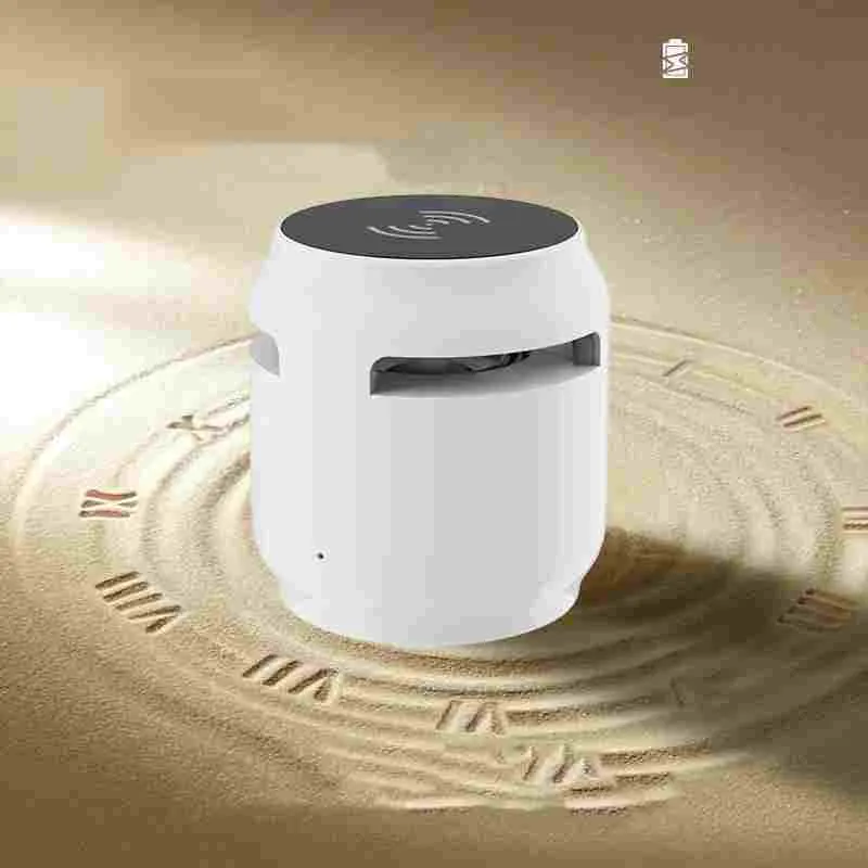 Wood grain wireless Bluetooth speaker with built-in wireless charger on a desk, 80x75x75mm plastic cabinet