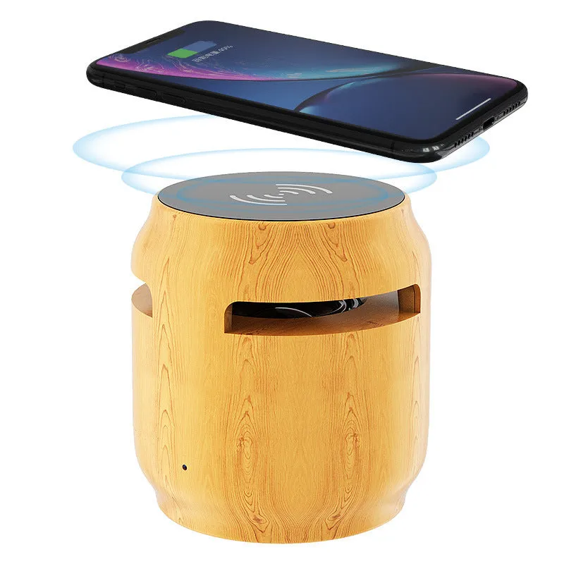 Wood grain wireless Bluetooth speaker with built-in wireless charger on a desk, 80x75x75mm plastic cabinet