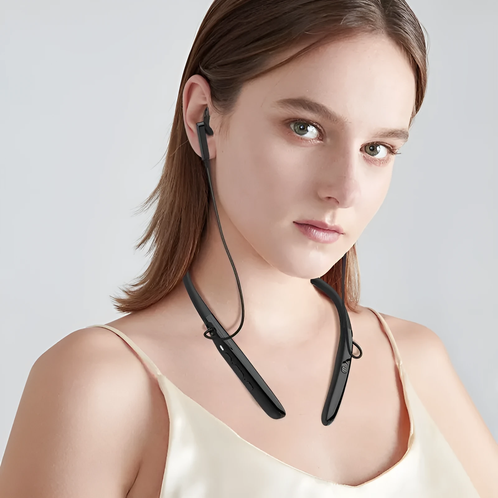 Black Bluetooth digital hearing aid with neck strap, USB port, and ABS plastic body on a white background