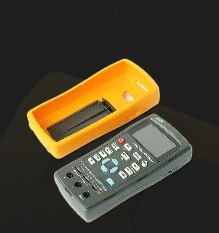 ET432 handheld LCR digital bridge with 2.8 inch TFT LCD screen and Kelvin test clamp on bench
