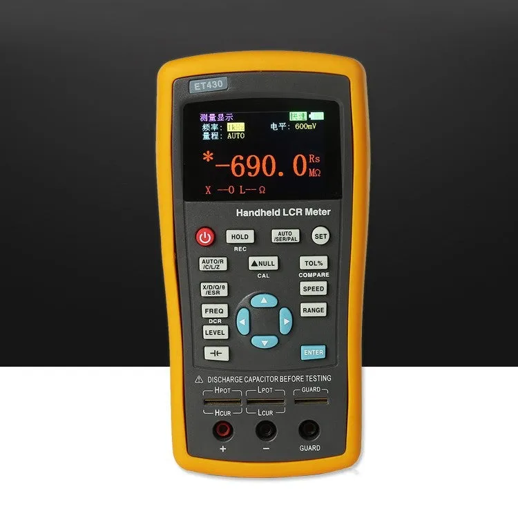 ET432 handheld LCR digital bridge with 2.8 inch TFT LCD screen and Kelvin test clamp on bench