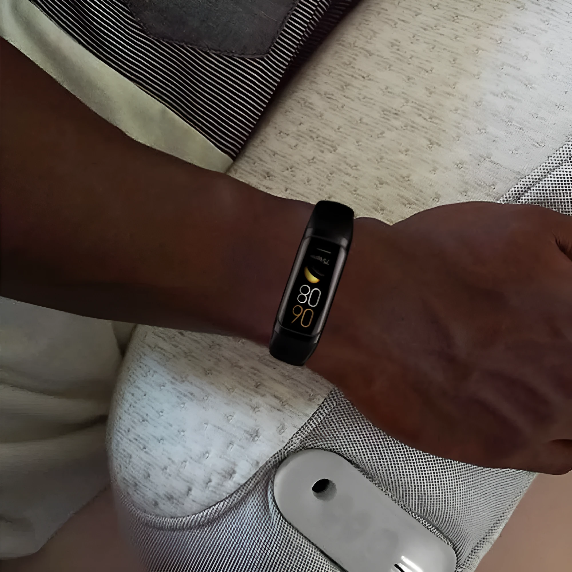 Sports watch with AMOLED screen and silicone strap showing health metrics on display