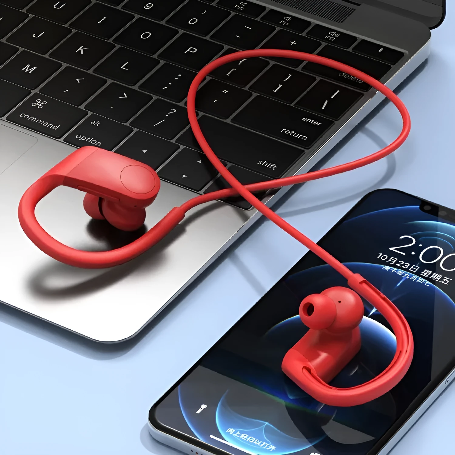 Wireless in-ear hanging Bluetooth headset in black with earbuds and neckband on white background