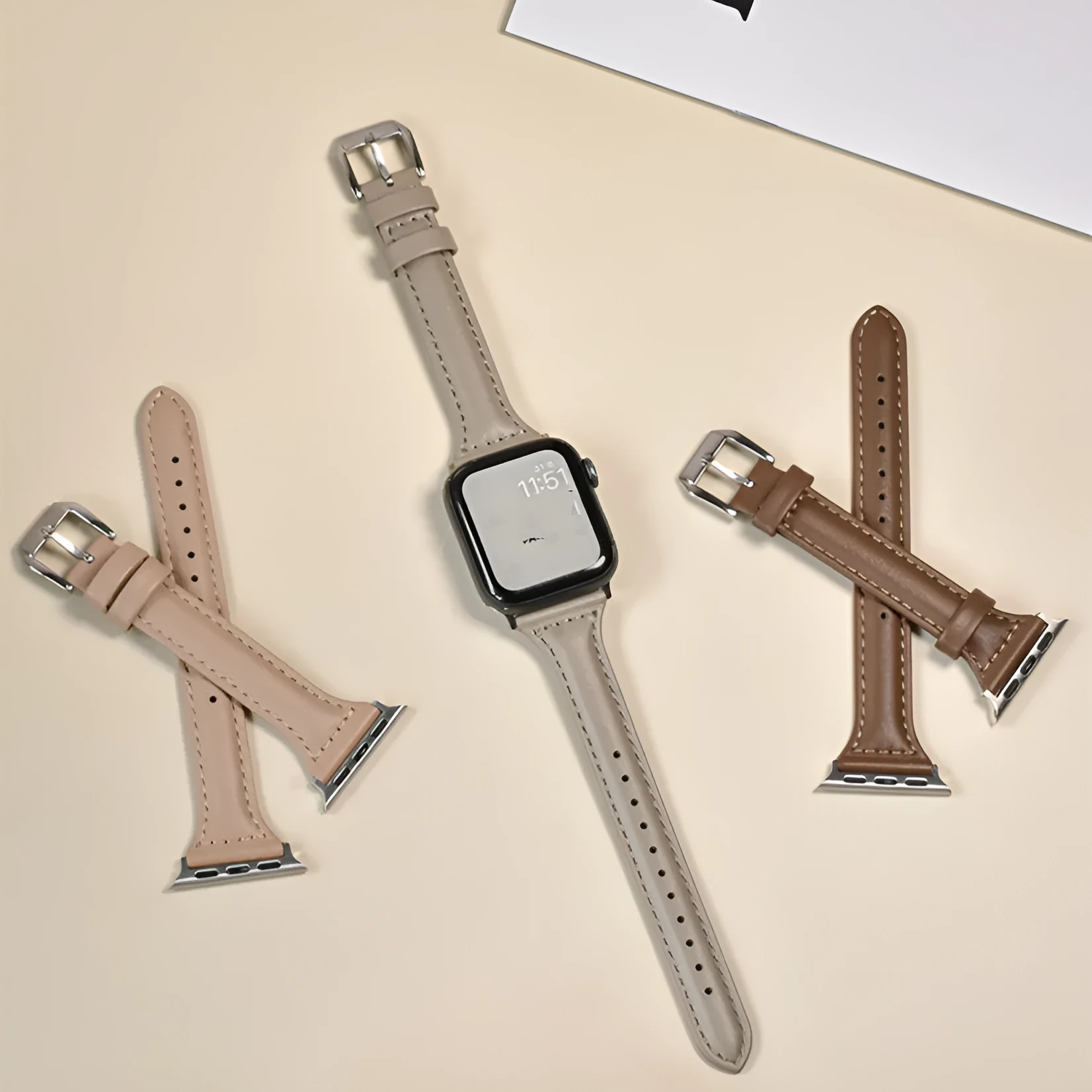 Women's retro slim leather strap for Apple Watch in cream apricot colour on a table