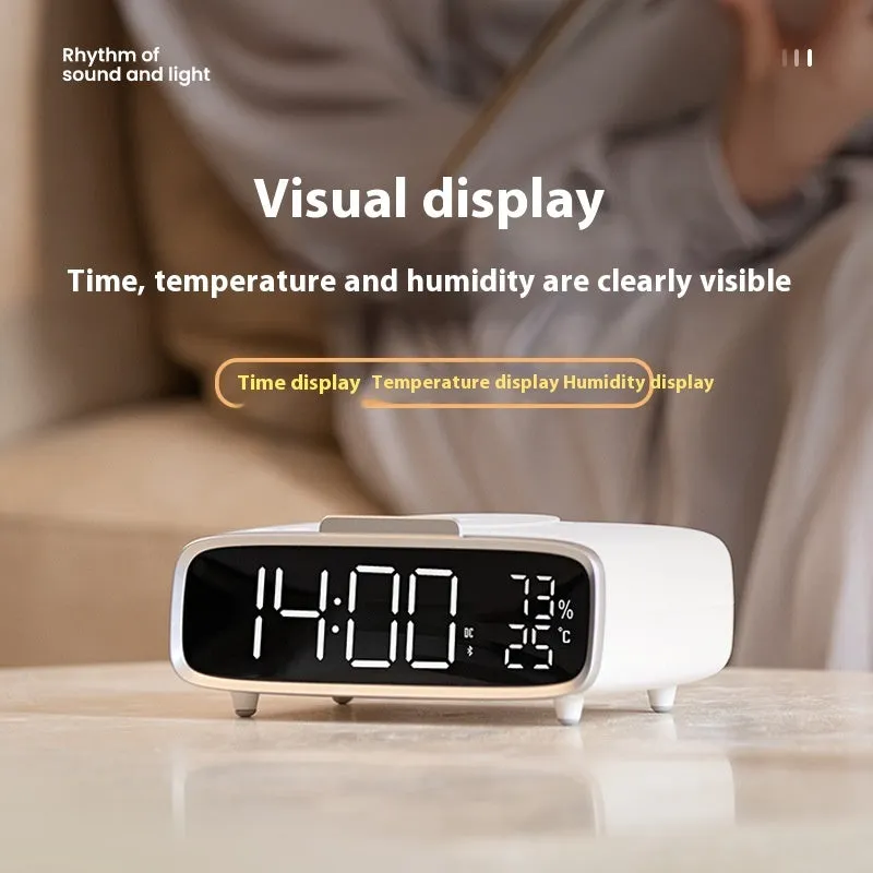 White round Bluetooth speaker wireless charger alarm clock with night light on bedside table