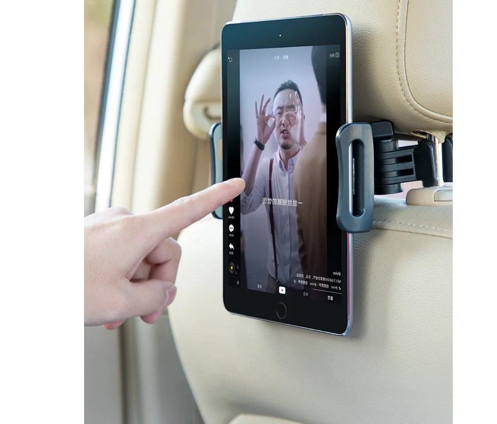Black car phone holder mounted to rear seat base holding tablet for navigation