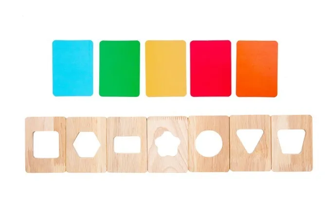 Wooden early education geometry puzzle with colour shape matching, trolley design, on a white background