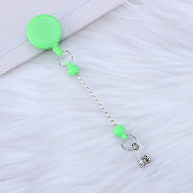 Plastic telescopic retractable keychain with anti-lost buckle, 16.6cm x 3.2cm, available in multiple colours