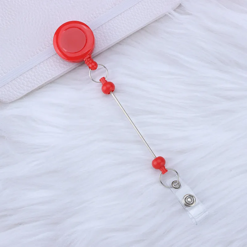 Plastic telescopic retractable keychain with anti-lost buckle, 16.6cm x 3.2cm, available in multiple colours