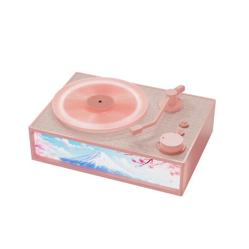 Light Painting Aromatherapy Bluetooth Speaker in elegant white with plastic casing and lighting effects on desktop