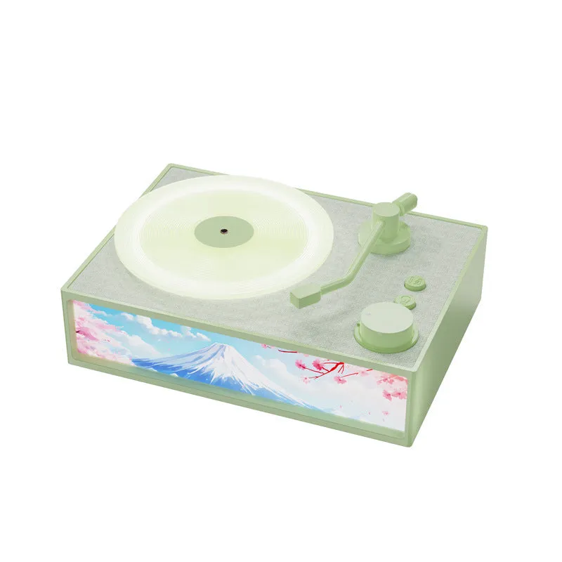 Light Painting Aromatherapy Bluetooth Speaker in elegant white with plastic casing and lighting effects on desktop