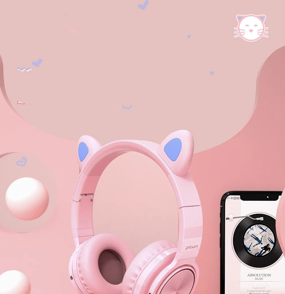 Pink and white Luminous wireless Bluetooth gaming headset with over-ear earcups and a braided cable.