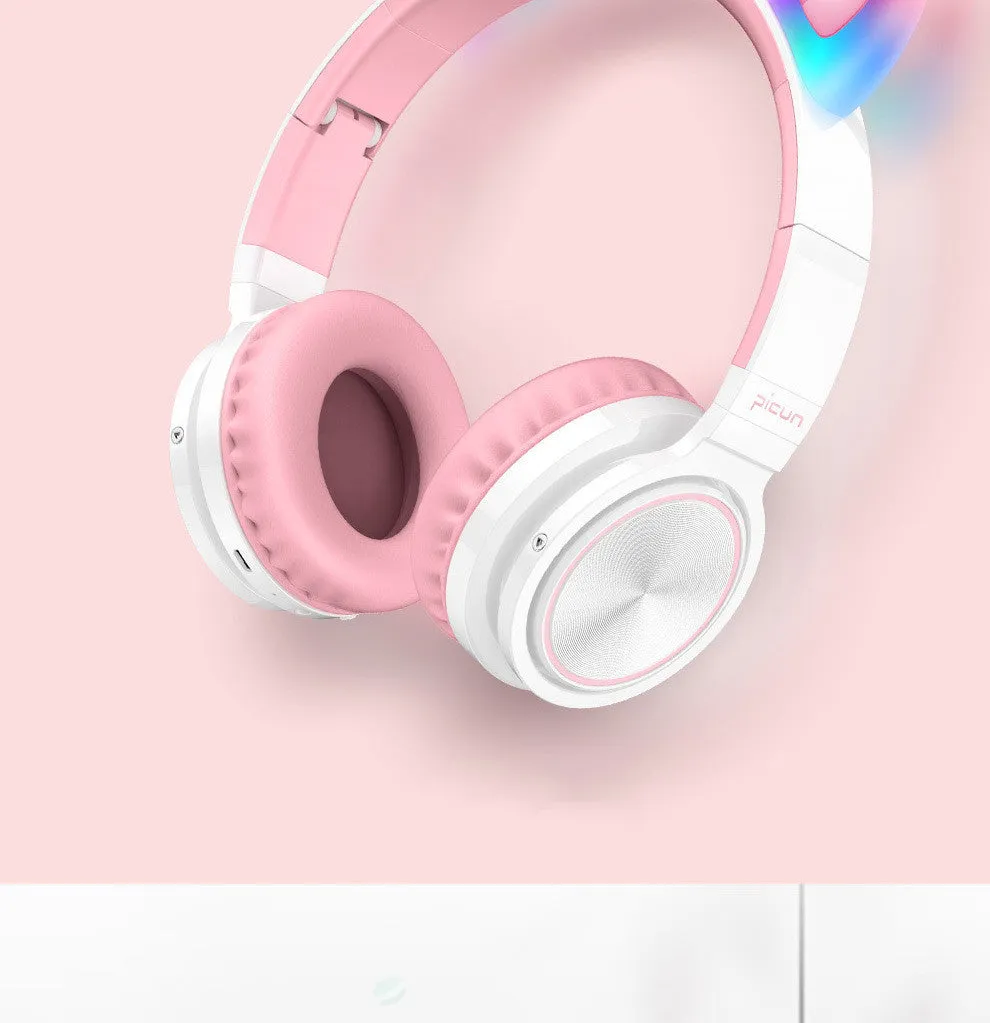 Pink and white Luminous wireless Bluetooth gaming headset with over-ear earcups and a braided cable.