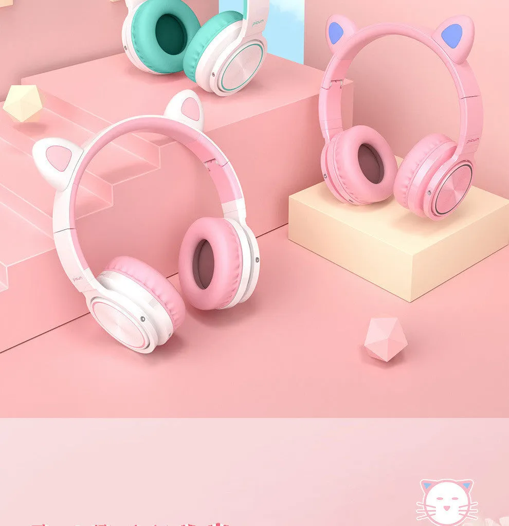 Pink and white Luminous wireless Bluetooth gaming headset with over-ear earcups and a braided cable.