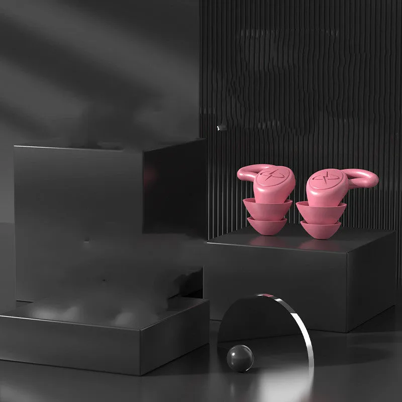 Pair of silicone noise reduction earplugs in black for sleep and sound insulation
