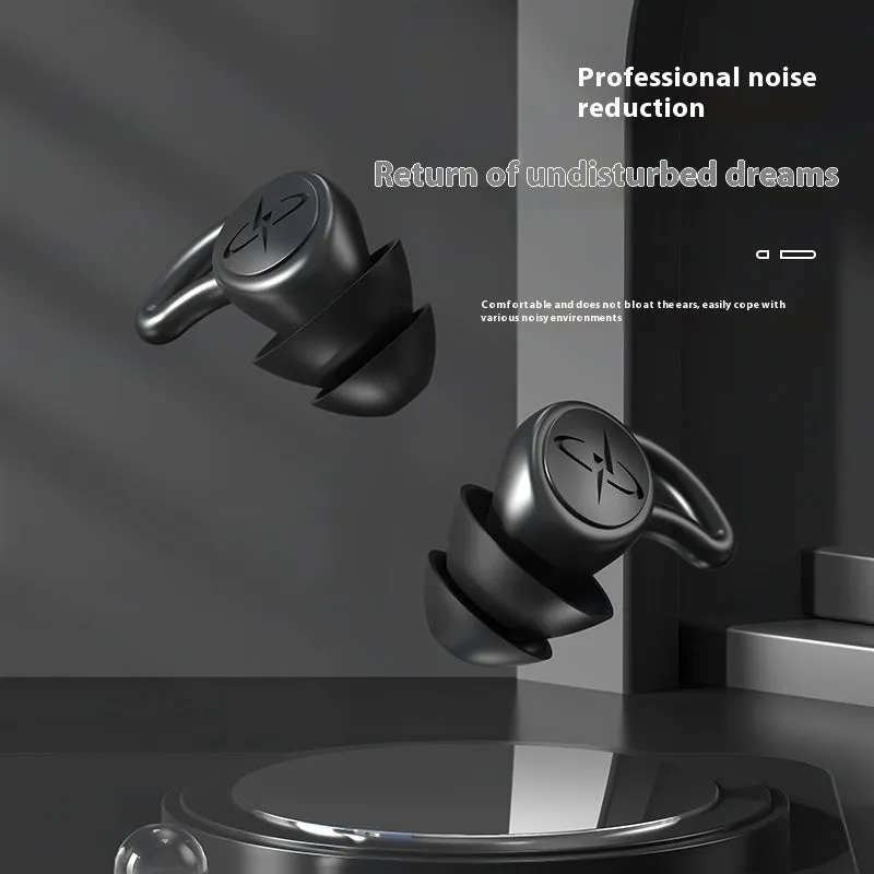 Pair of silicone noise reduction earplugs in black for sleep and sound insulation