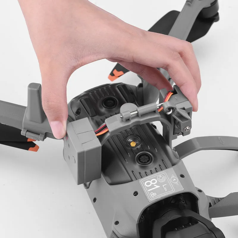 DJI Air 3 parabolic delivery device in dark grey ABS, with tripod feet and USB charging cable