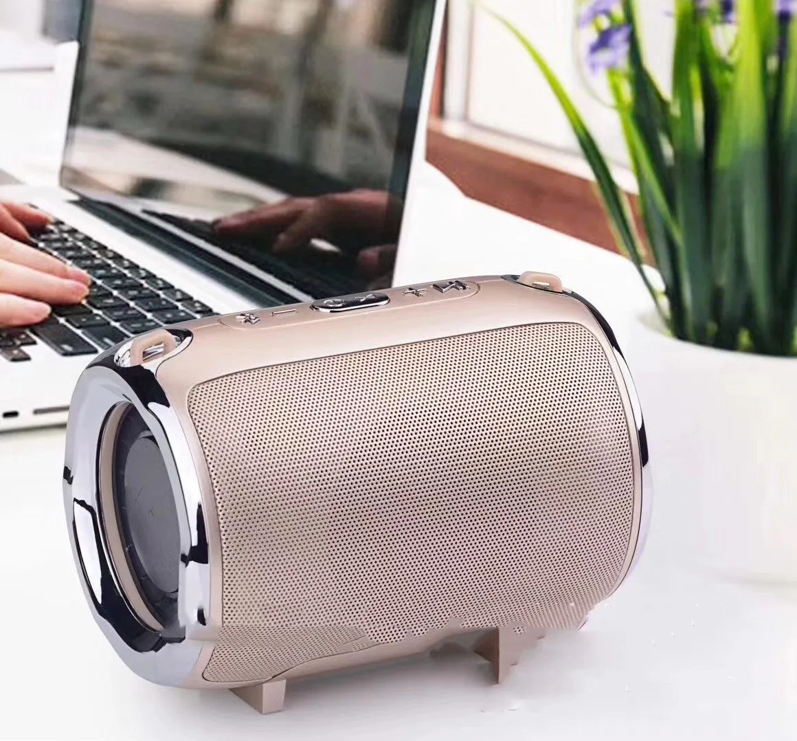 Portable Bluetooth subwoofer speaker in metal casing with USB and SD card slots for playback