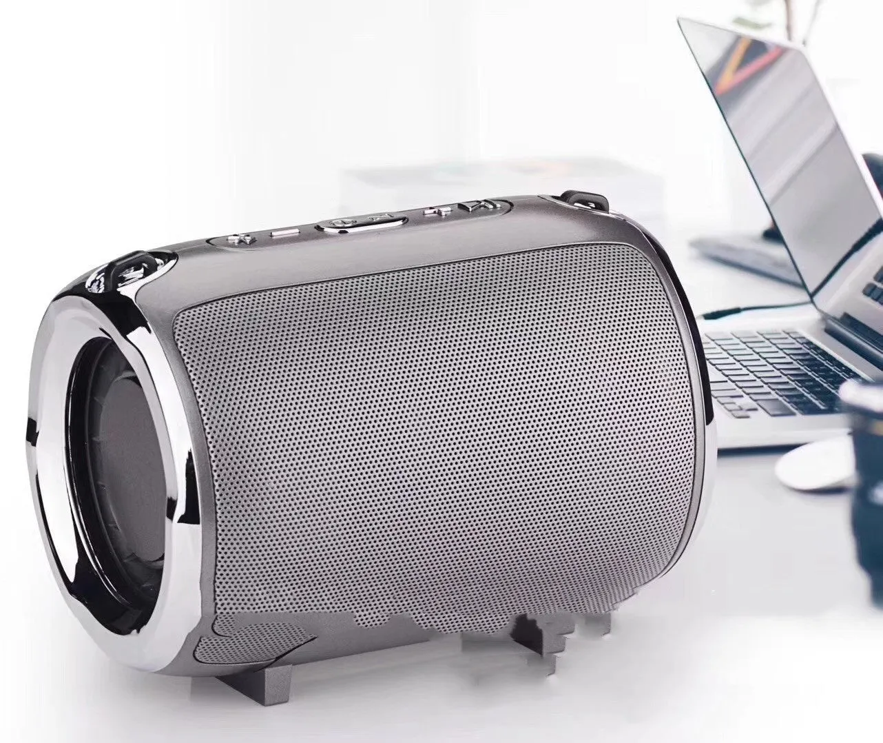 Portable Bluetooth subwoofer speaker in metal casing with USB and SD card slots for playback