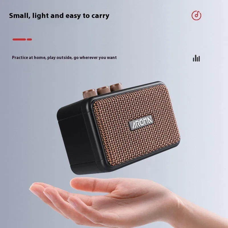 AG04 mini portable electric guitar loudspeaker box in plastic casing with data cable