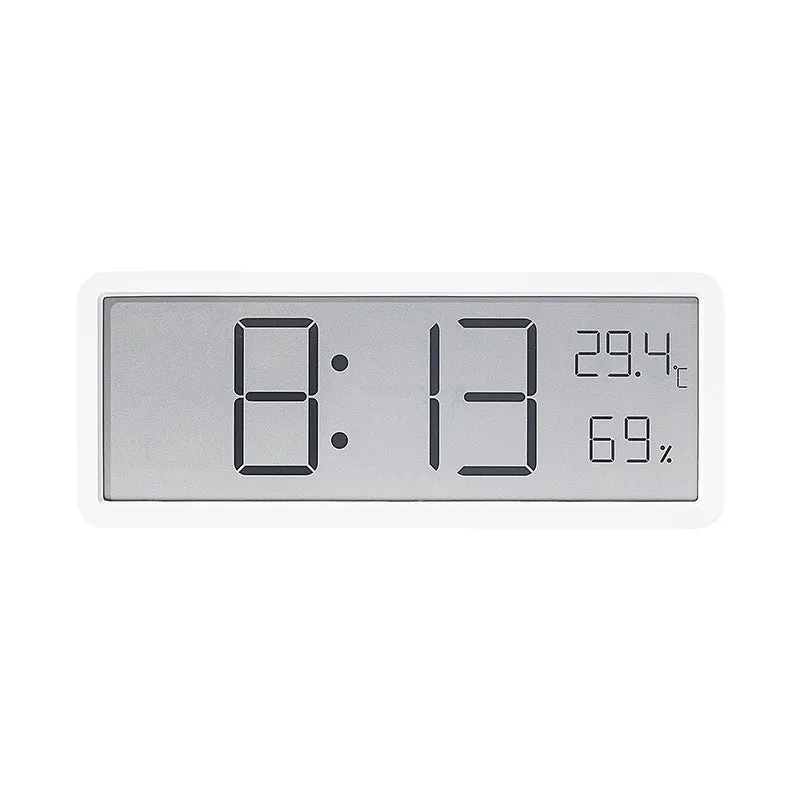 Simple large screen temperature and humidity clock with plastic shell in white Nordic style on a desk