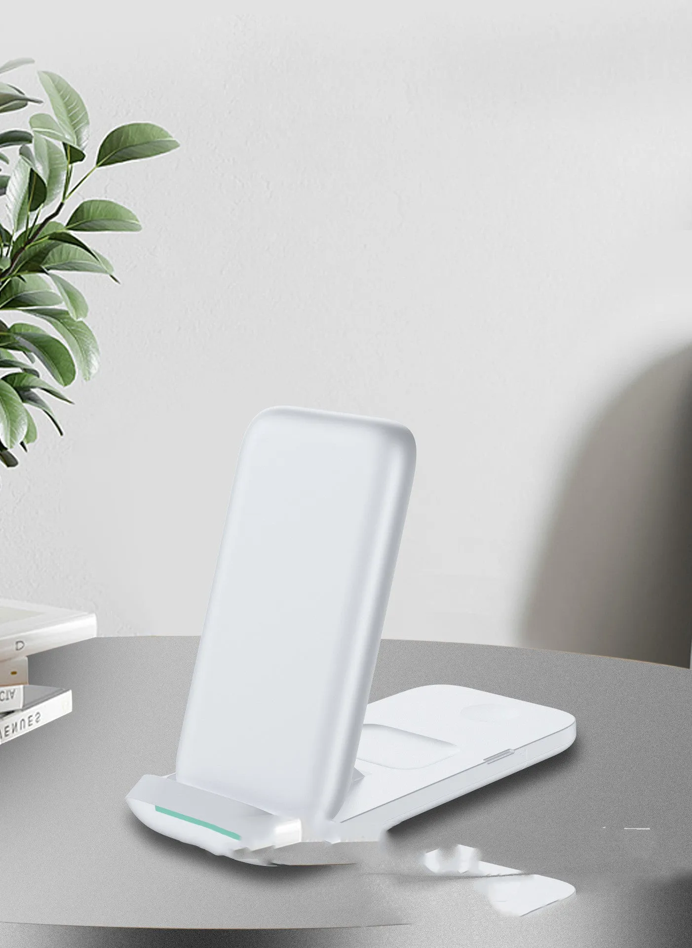 Foldable 3-in-1 wireless charging station showing charging surfaces for iPhone, AirPods, and Apple Watch